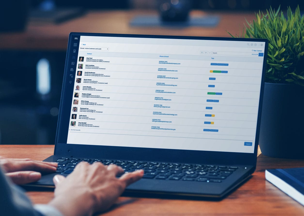 Computer laptop showing a list of contacts in Method CRM.