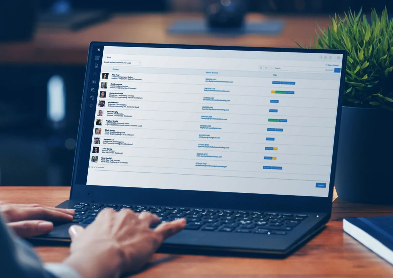 Computer laptop showing a list of contacts in Method:CRM.