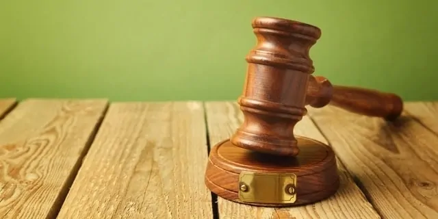 Gavel sitting on wooden table