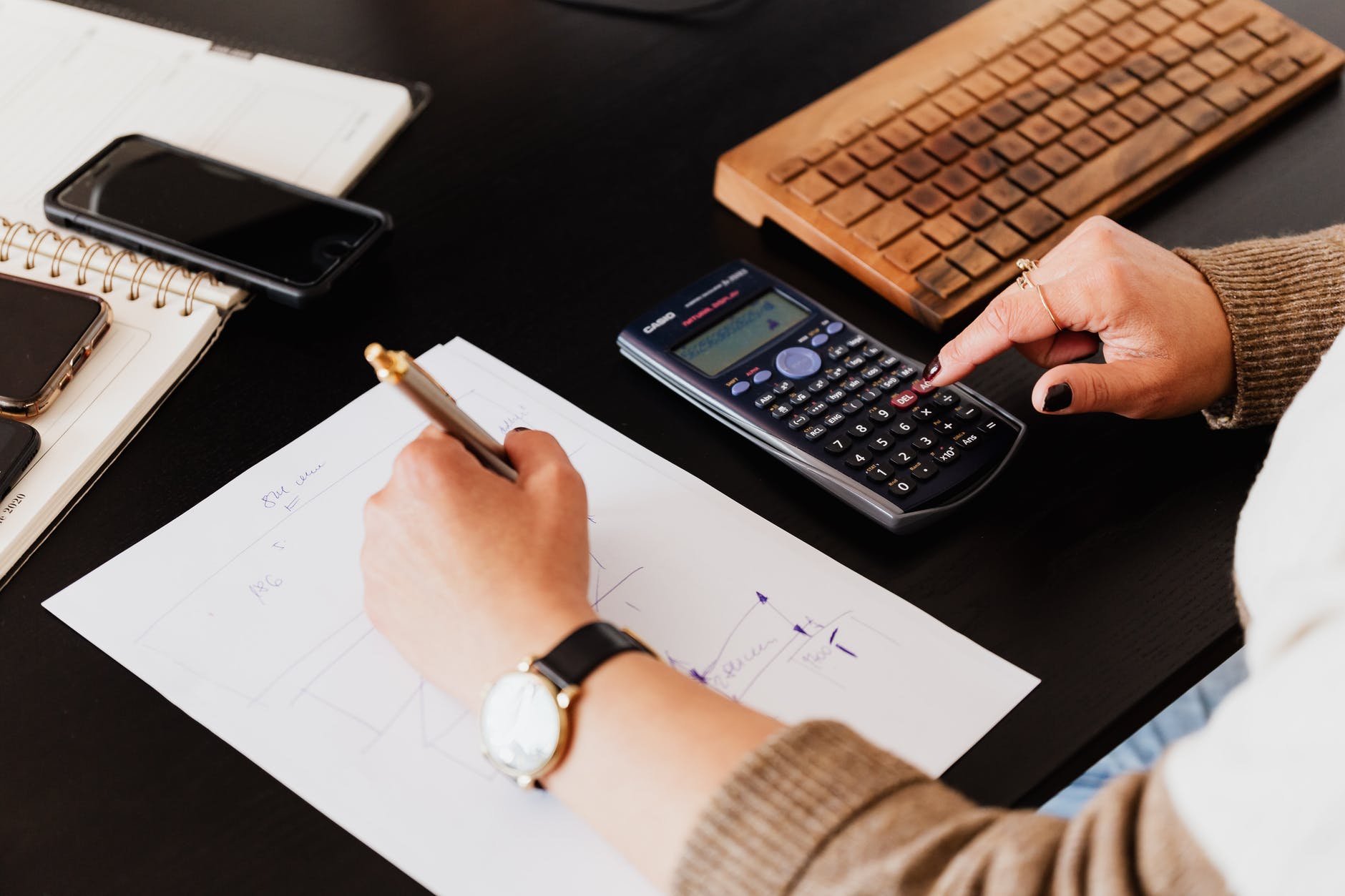 An accountant using a calculator