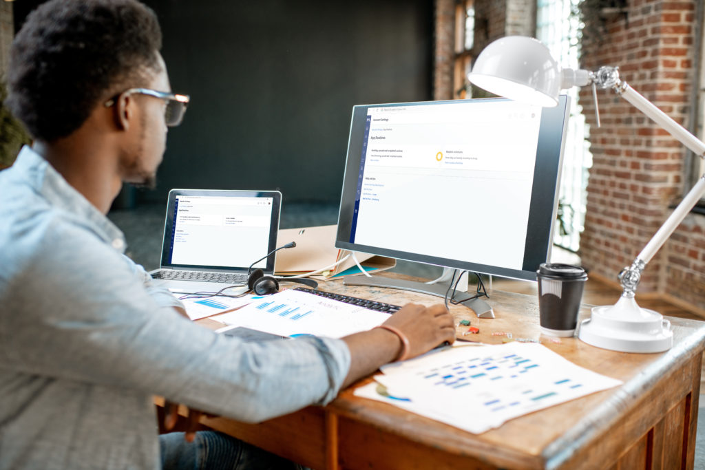 Man using computer to automate tasks through Method Account Settings