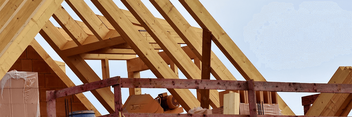 Wooden frame of a roof on a house.