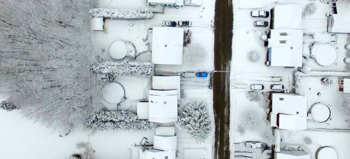 aerial photo of snow covered residential area