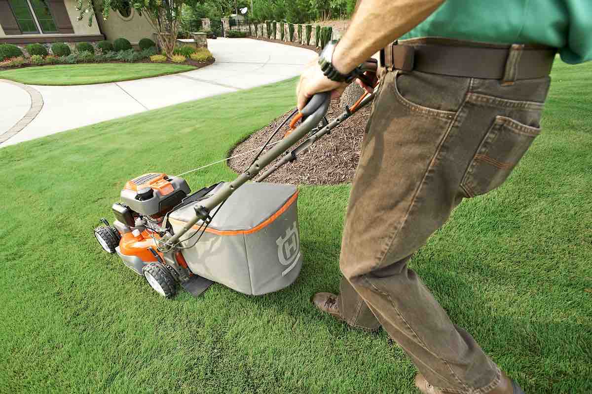 Person mowing lawn