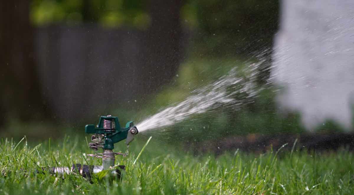 Impact sprinkler sprinkling on a lawn