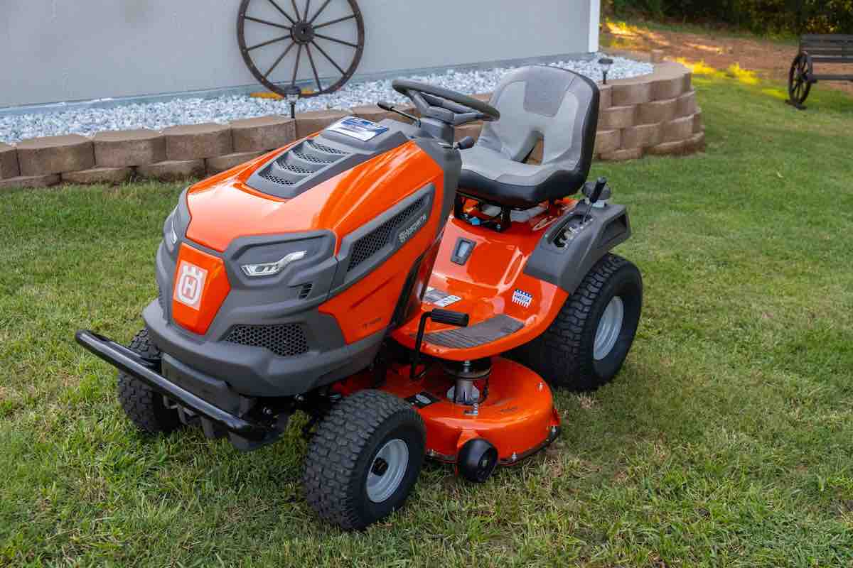 orange and black ride-on lawn mower