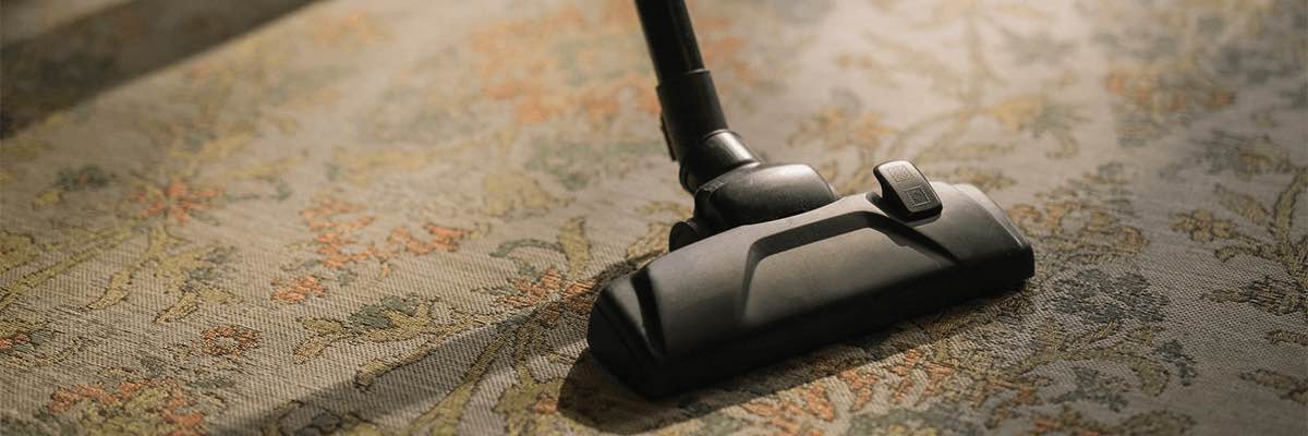 Black Vacuum Cleaner on Area Rug