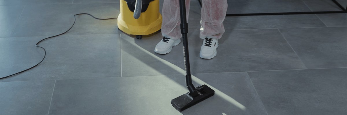 A Close-Up Shot of a Person Using a Vacuum Cleaner