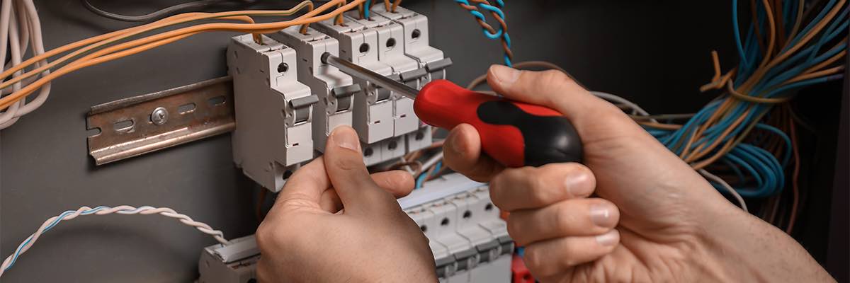 electrician repairing distribution board