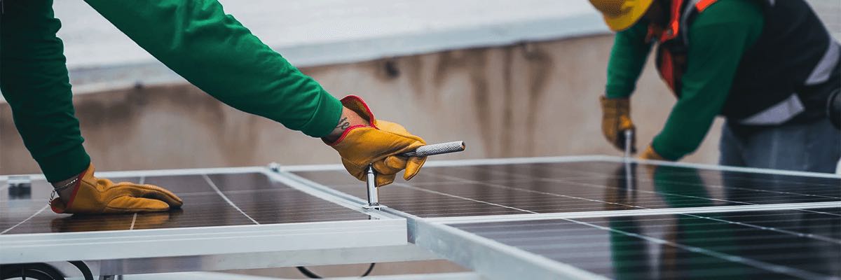 Solar panel installation by two people