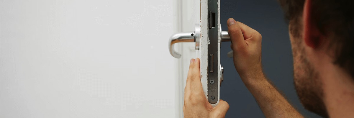 person holds door lever