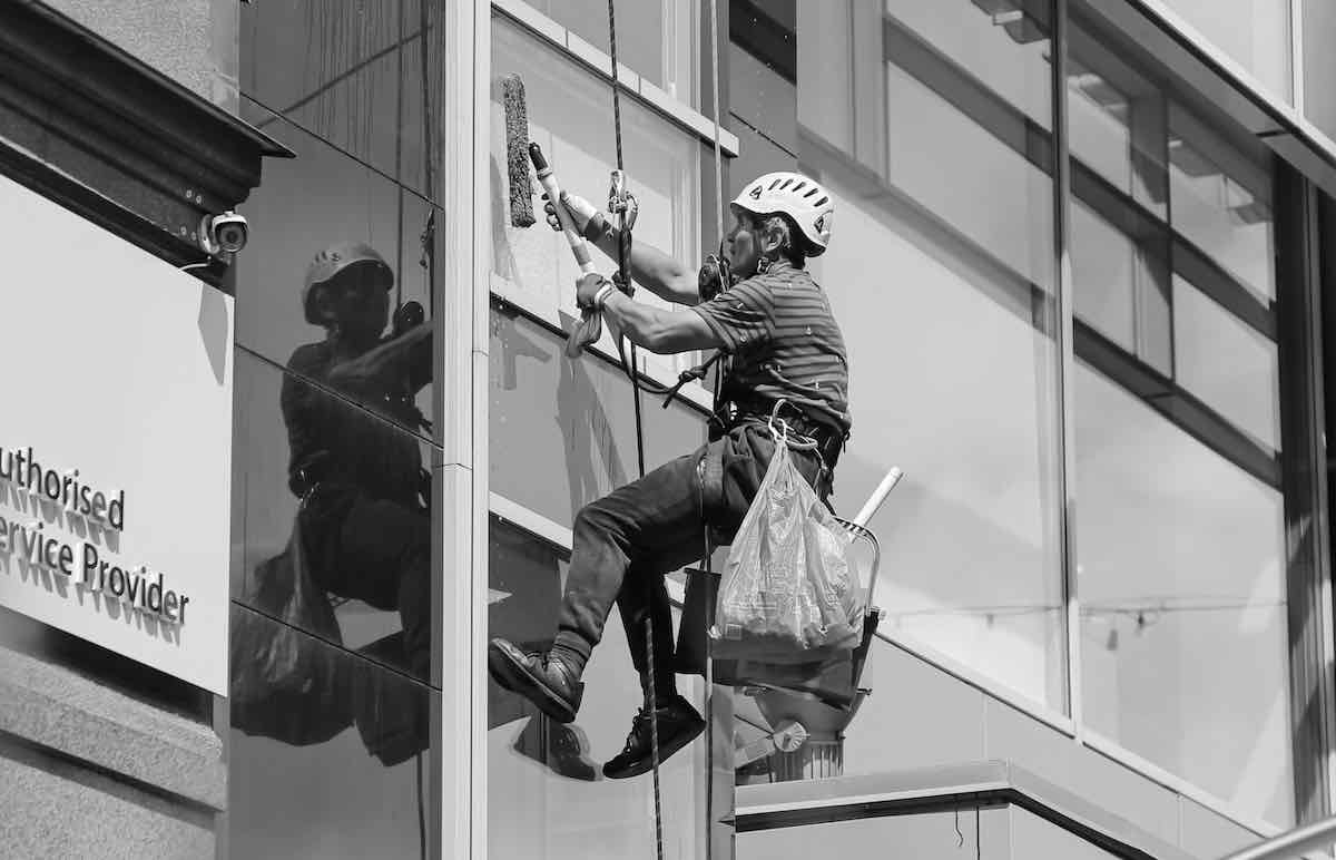 window cleaner cleaning windows