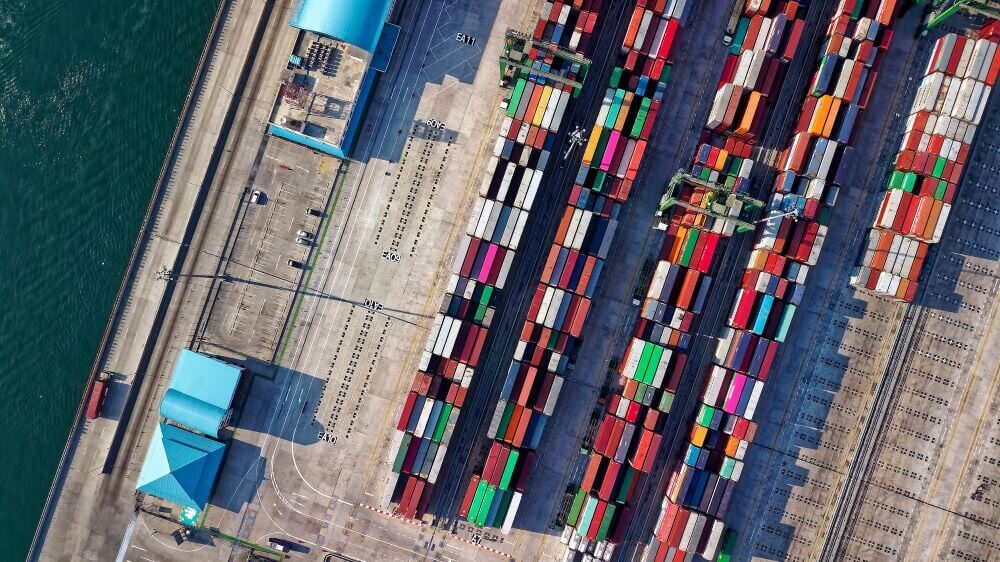 Aerial view of many colorful shipping containers.