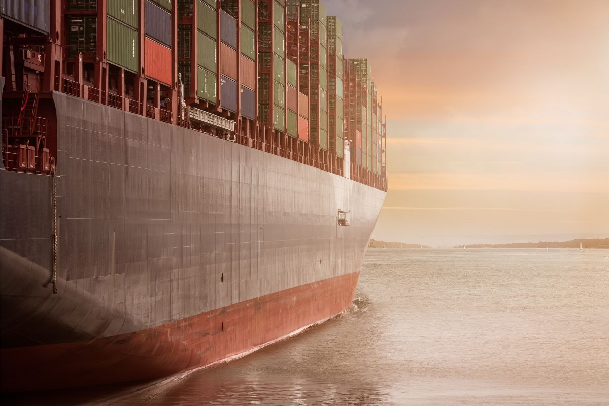 A ship loaded with containers on the water.