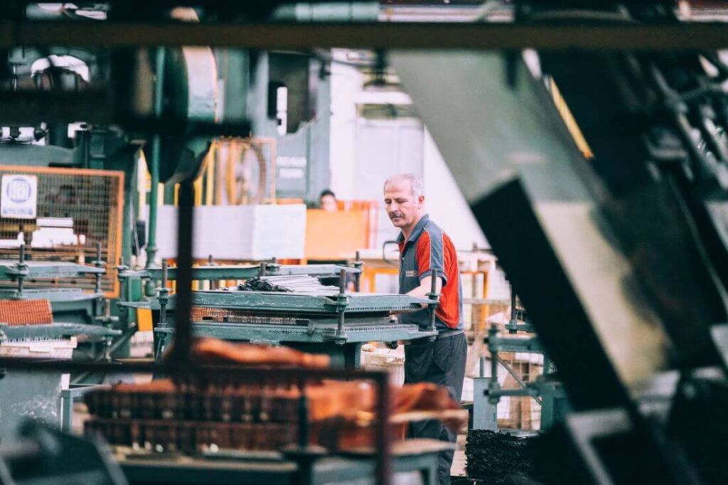 A man busy at work in a warehouse.