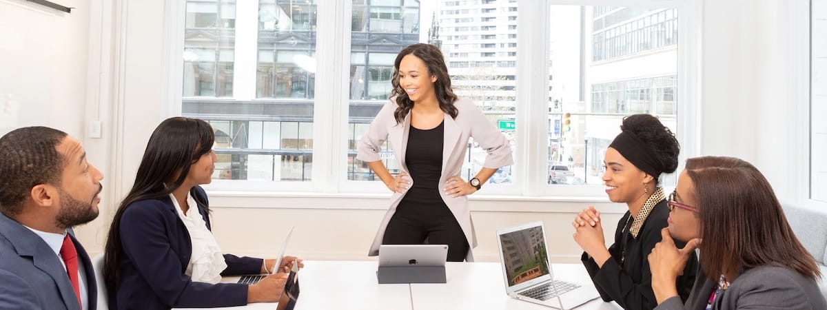 People in a meeting looking happier than one would think