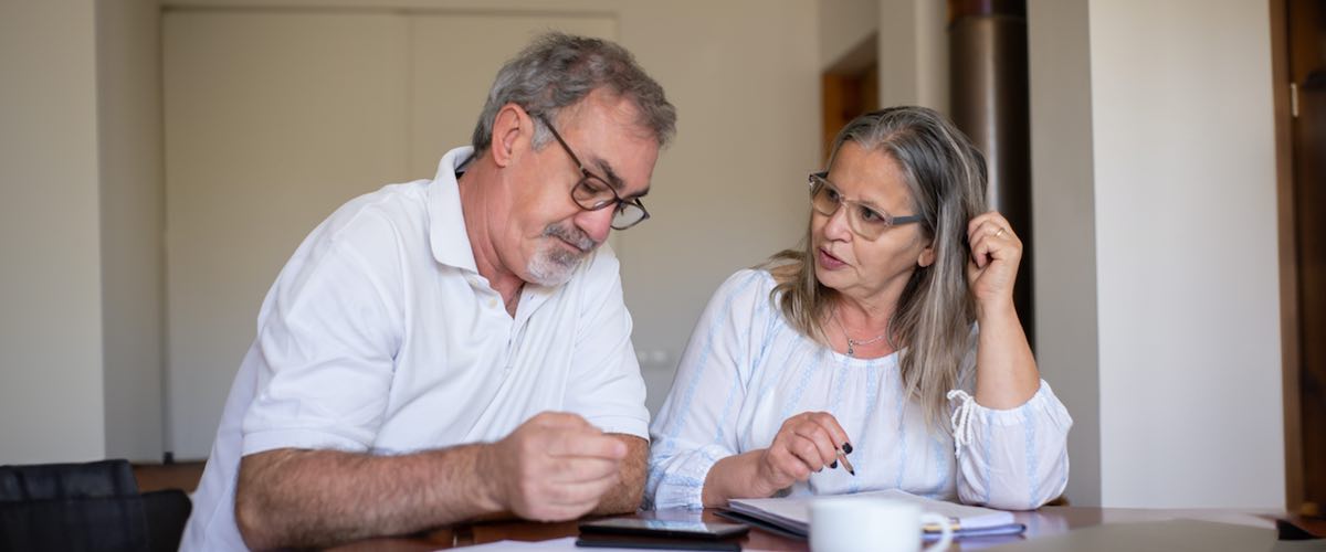 Man and Woman Sitting at Table