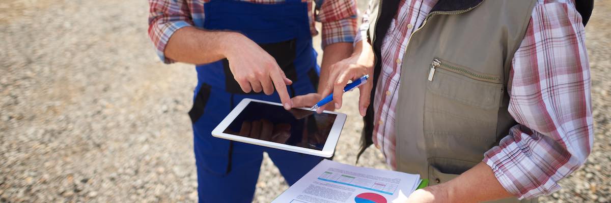 High angle view on modern farmers with digital tablet