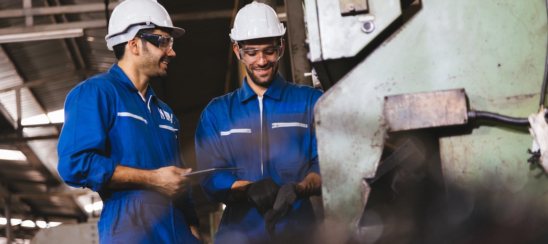 Two men talking to each other at construction sites