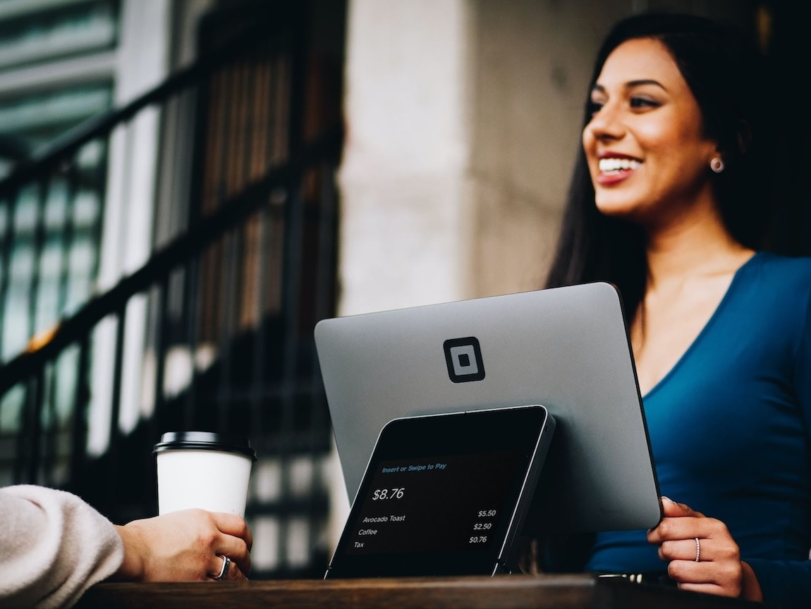 Woman smiling while working on computer