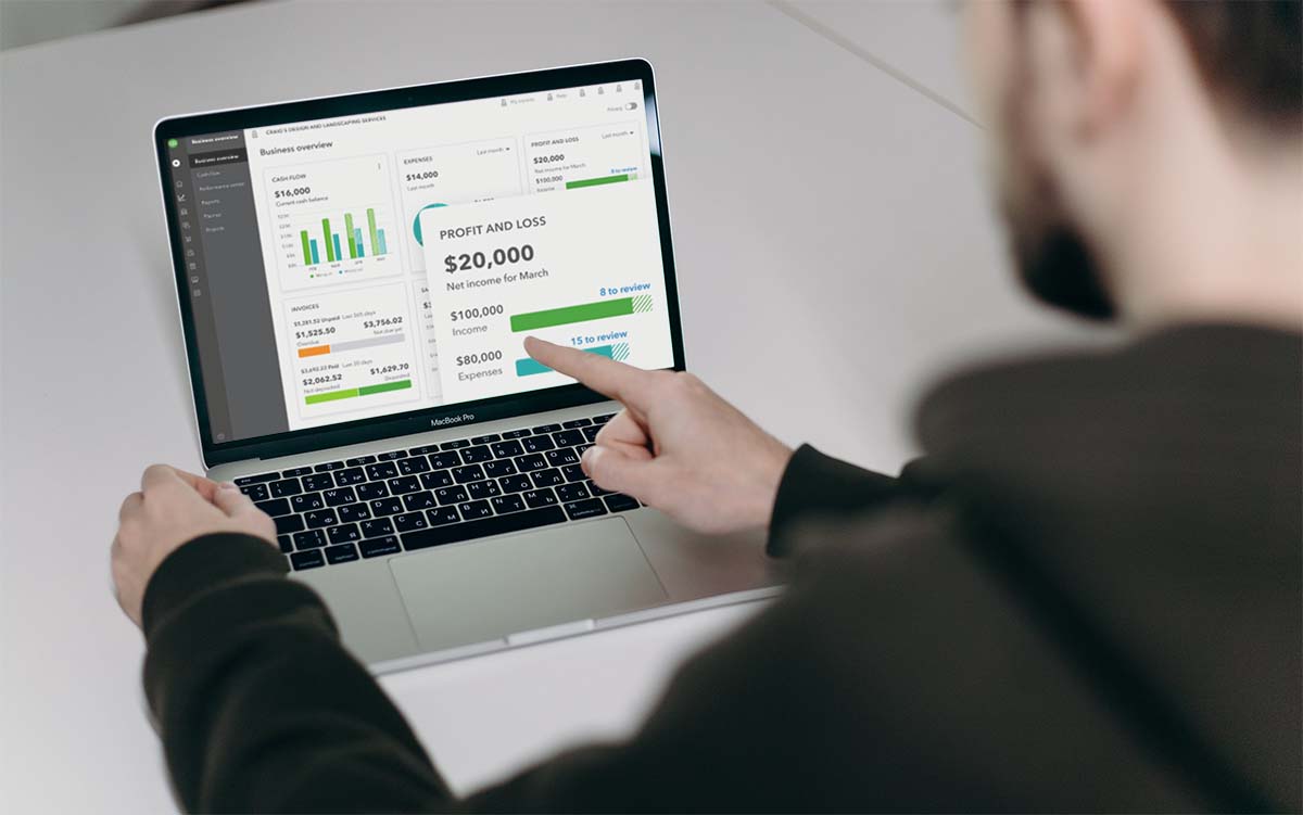 Person in Black Long Sleeve Shirt Using Macbook Pro showing the dashboard of QuickBooks Online