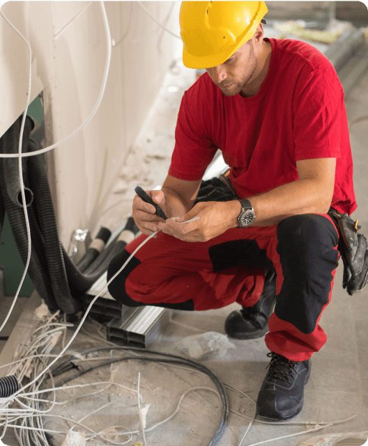 Electrician performing field service work.
